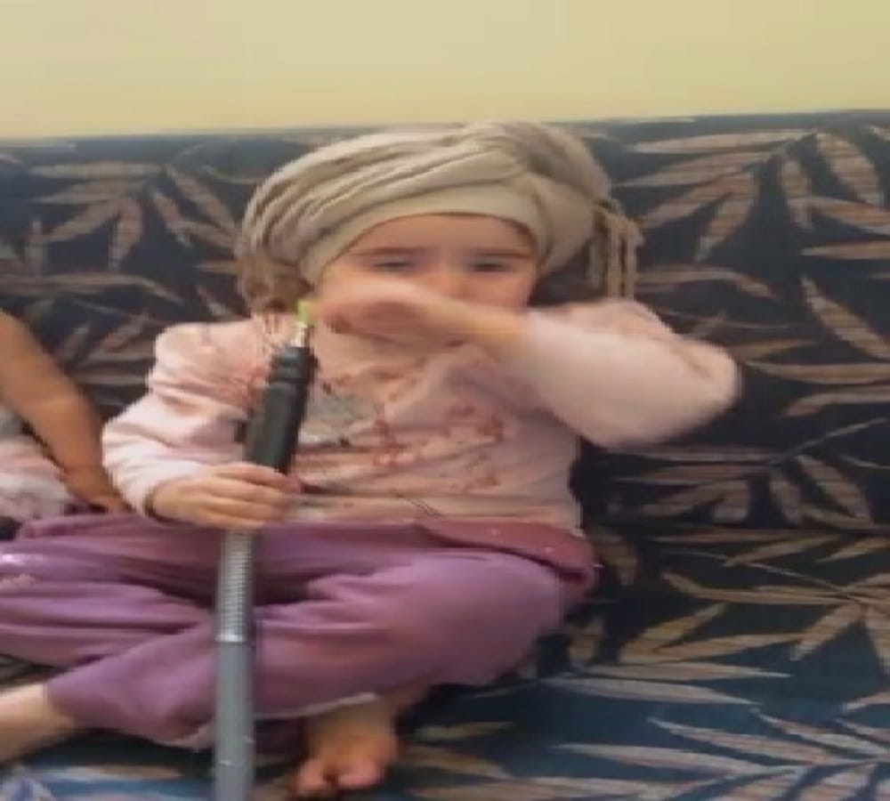 little girl has such a hobby to drink hookah in haryana style