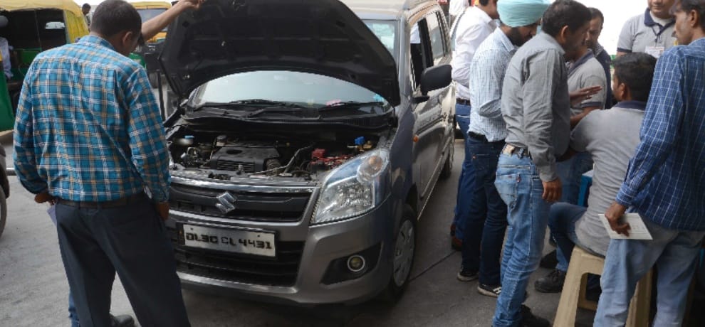 long queues of cars for getting cng stickers