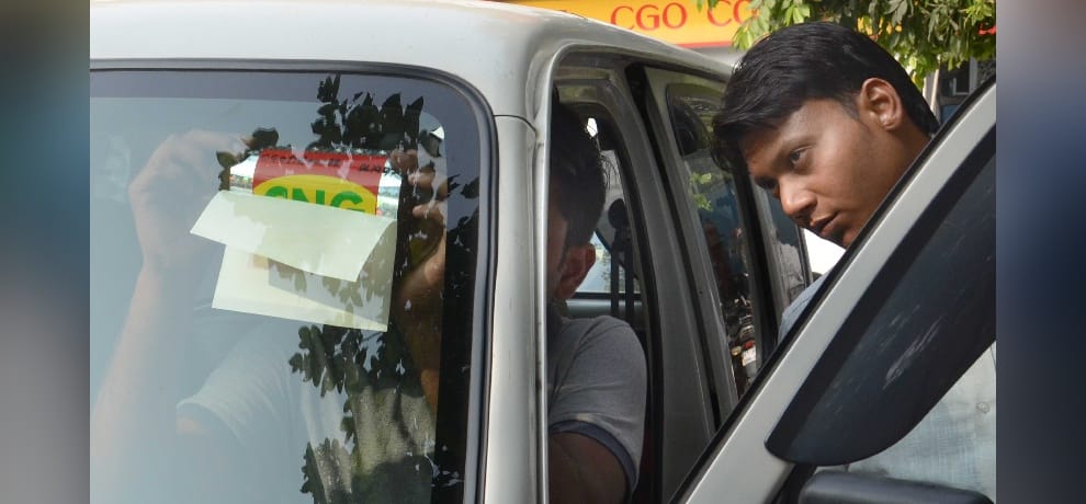 long queues of cars for getting cng stickers