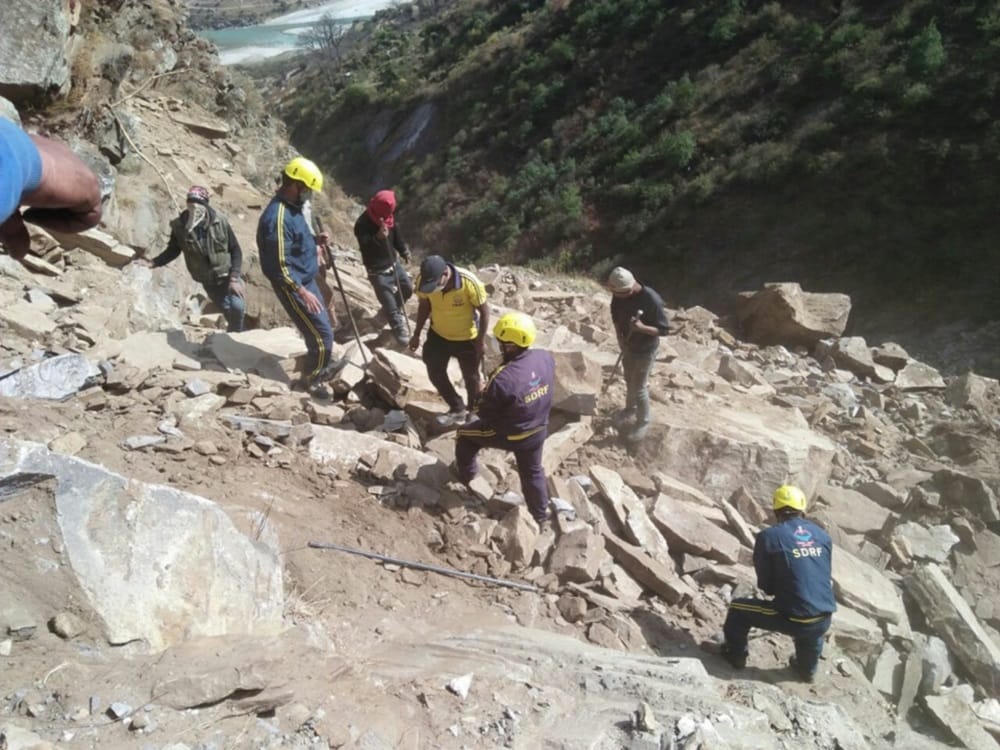 sdrf team rescue villager dead body from under Rock