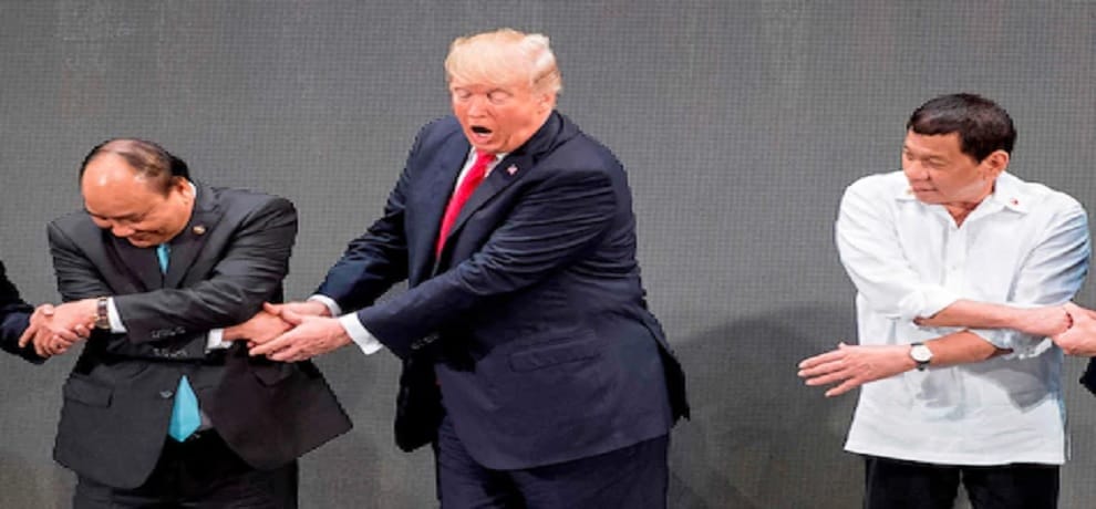 Donald Trump baffled by group handshake in ASEAN summit