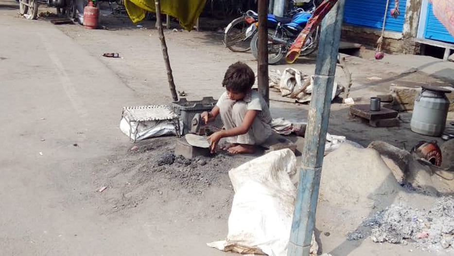 at the time of studies small boys are doing labouring