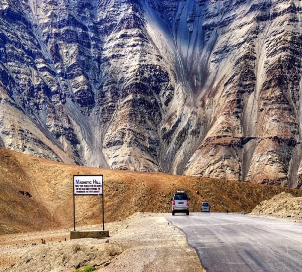car climb up itself on Magnetic hill in leh