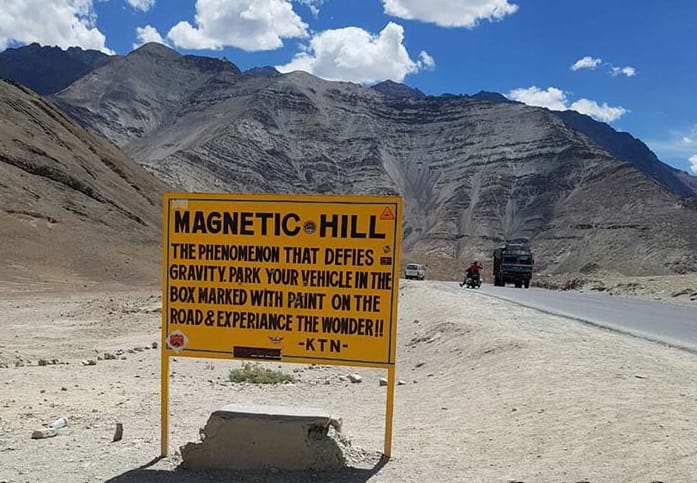 car climb up itself on Magnetic hill in leh