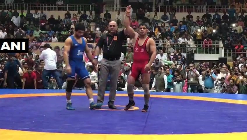 Sushil walks over to a gold Sakshi Geeta excel at National Wrestling