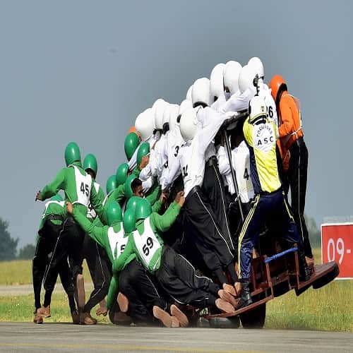 Army Service Corps attempts a record for the most men on a single moving motor cycle