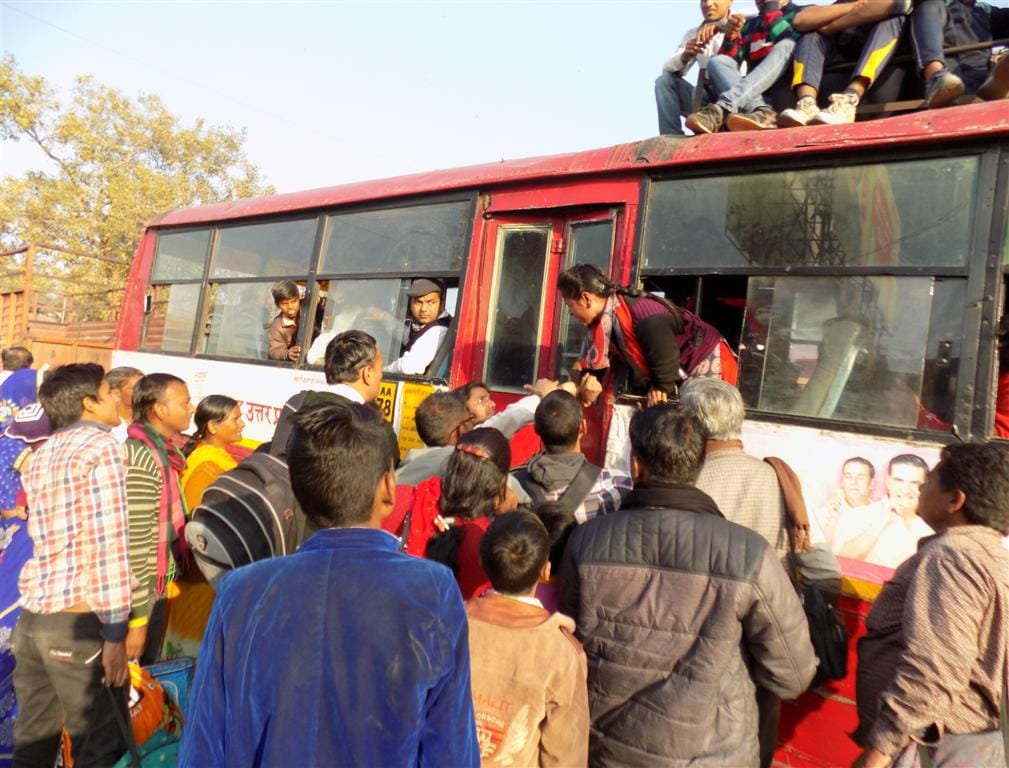 Female bus conductor and passengers in no-nonsense, commotion