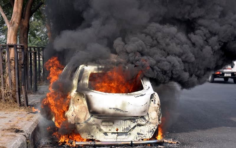 burning car on the road in lucknow 
