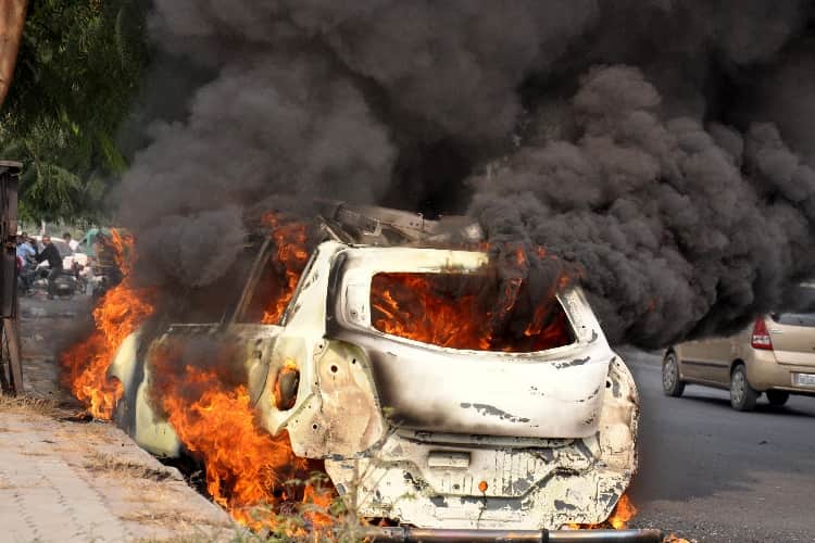 burning car on the road in lucknow 