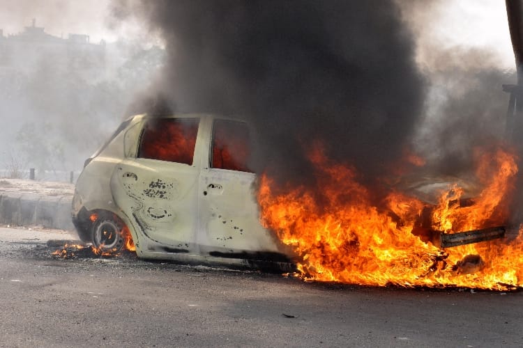 burning car on the road in lucknow 