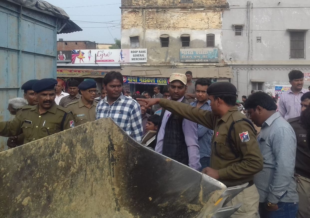 Bulldozer on broken encroachment, broken shops
