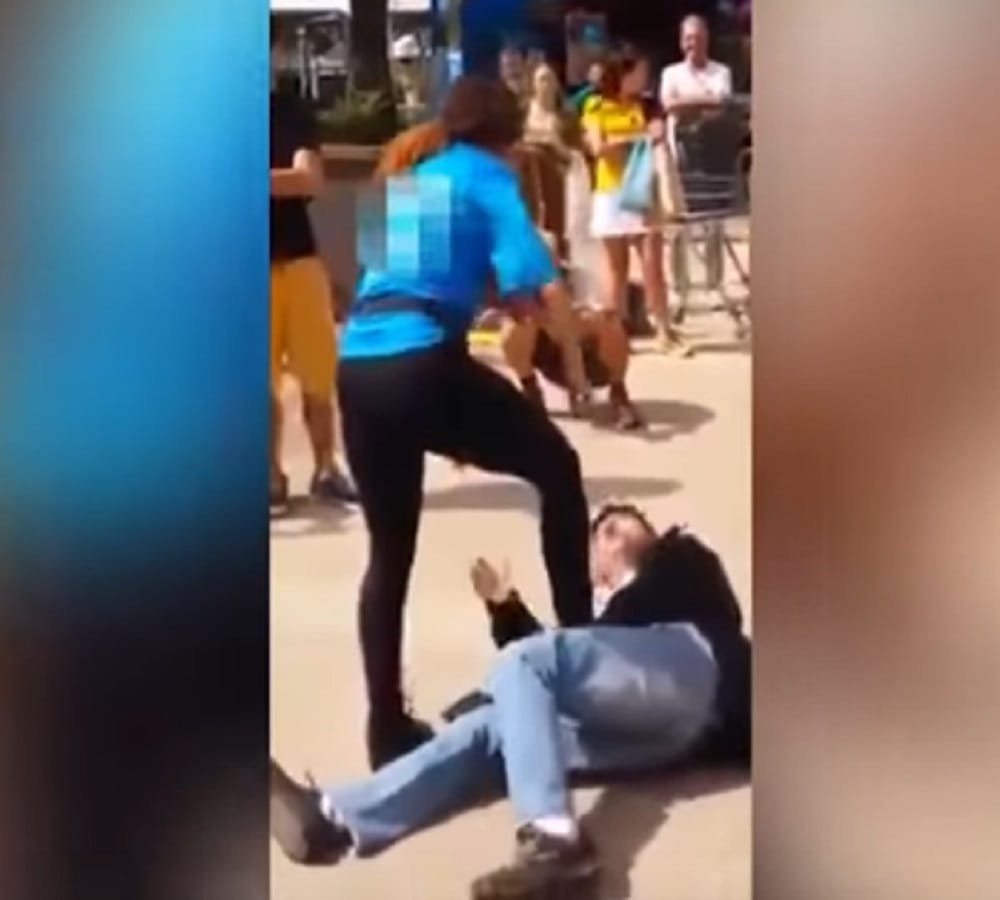 After teasing incident Woman rubs breasts on mans face in street