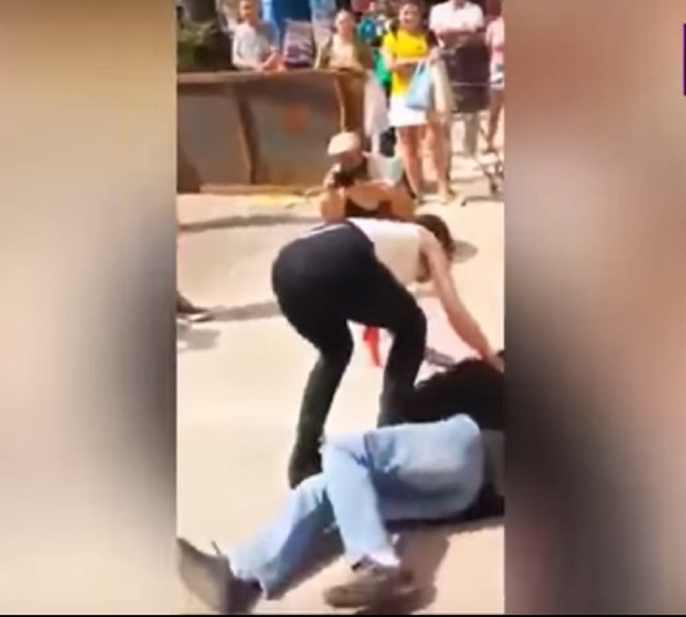 After teasing incident Woman rubs breasts on mans face in street