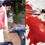 गाड़ी से कुदाल उठाता युवक