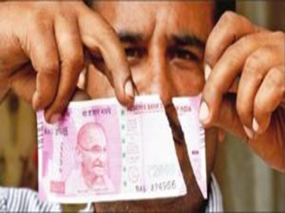 rbi rules to exchange damaged indian currency