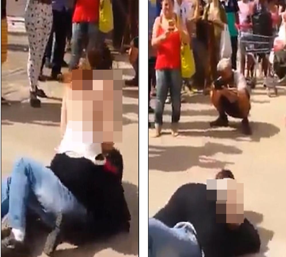 After teasing incident Woman rubs breasts on mans face in street