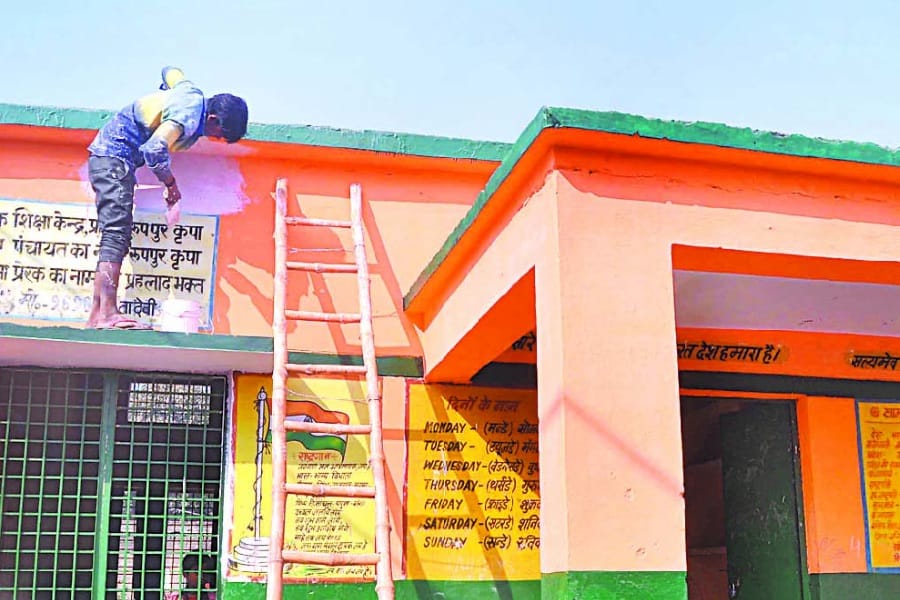 district magistrate scold principal on panting school with Saffron color