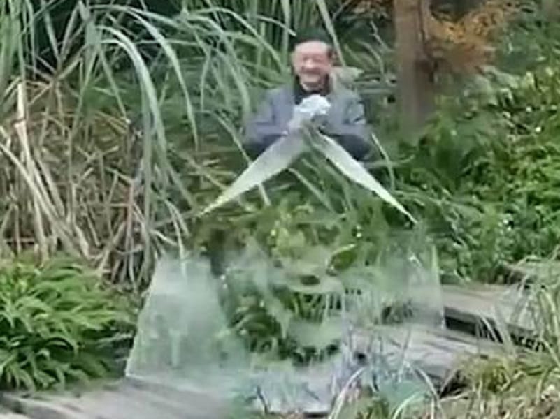This Chinese man made unique table cloth which turns him invisible