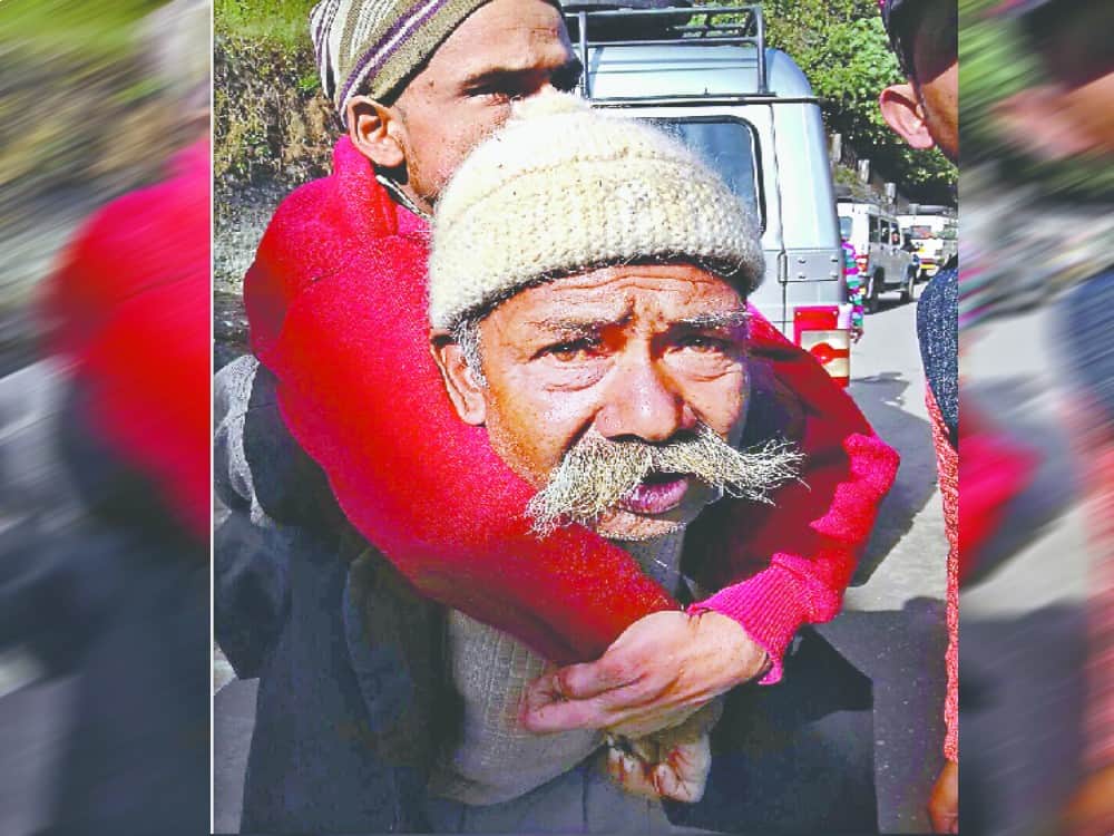 for aadhaar 70 year old father Loaded his disabled son on back in tilwada