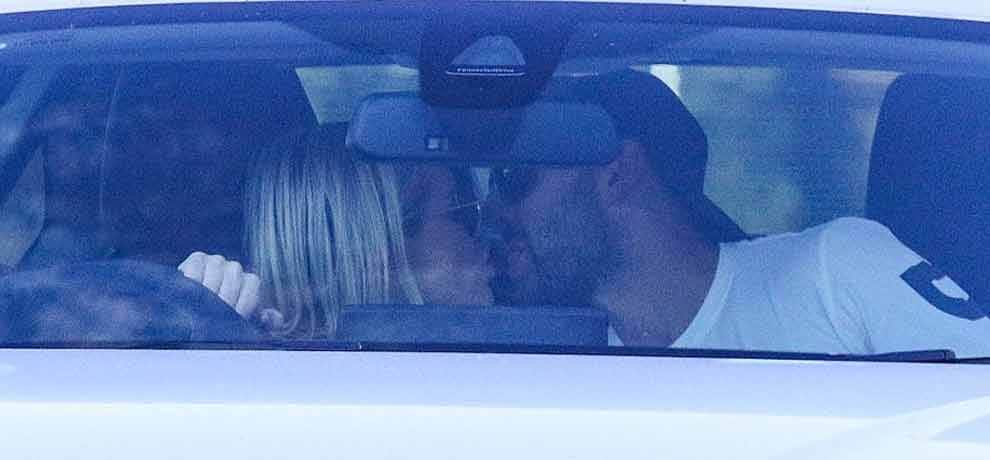 Australian cricketer Nathan Lyon passionately kisses glamorous blonde