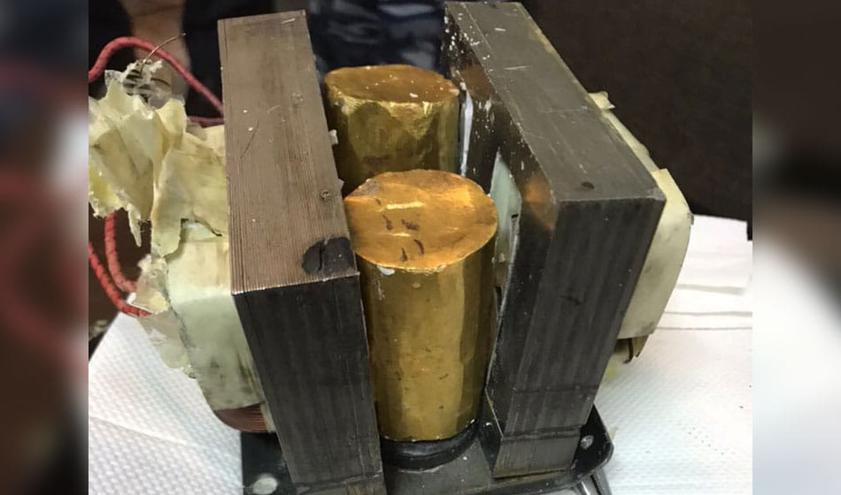 gold cylindrical Microwave oven seized at igi airport with market value of Rs 56,69,400
