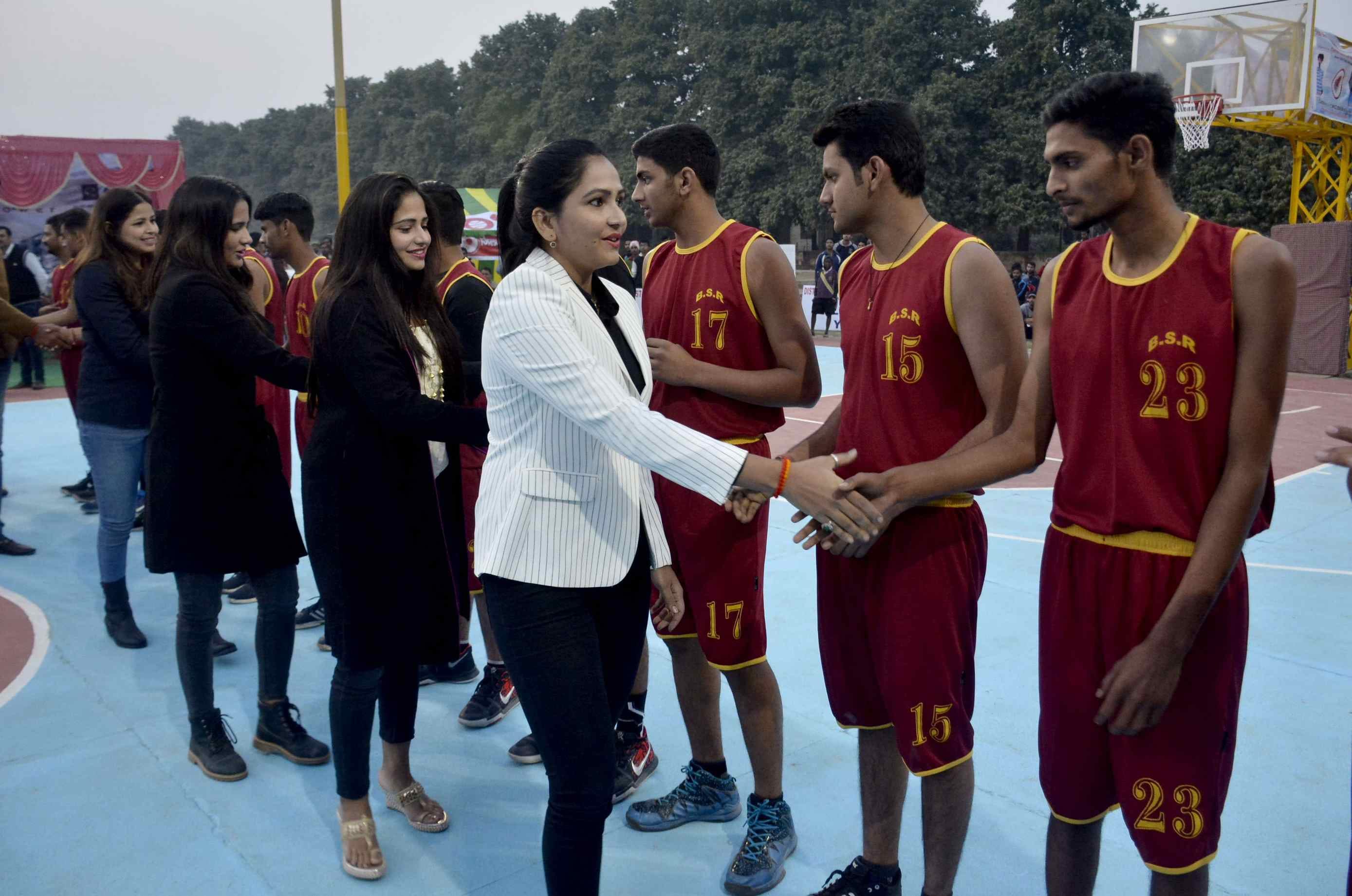 singh sisters with another international basketball player reach up college