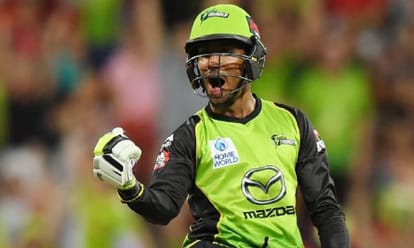 sydney thunder wicket keeper Jos Buttler cops helmet blow in big bash league season first match 