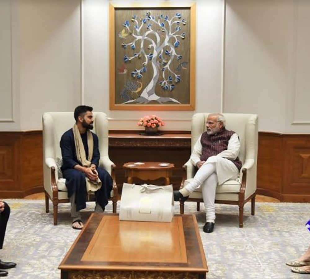 anushka sharma and virat kohli met pm modi and give invitation card