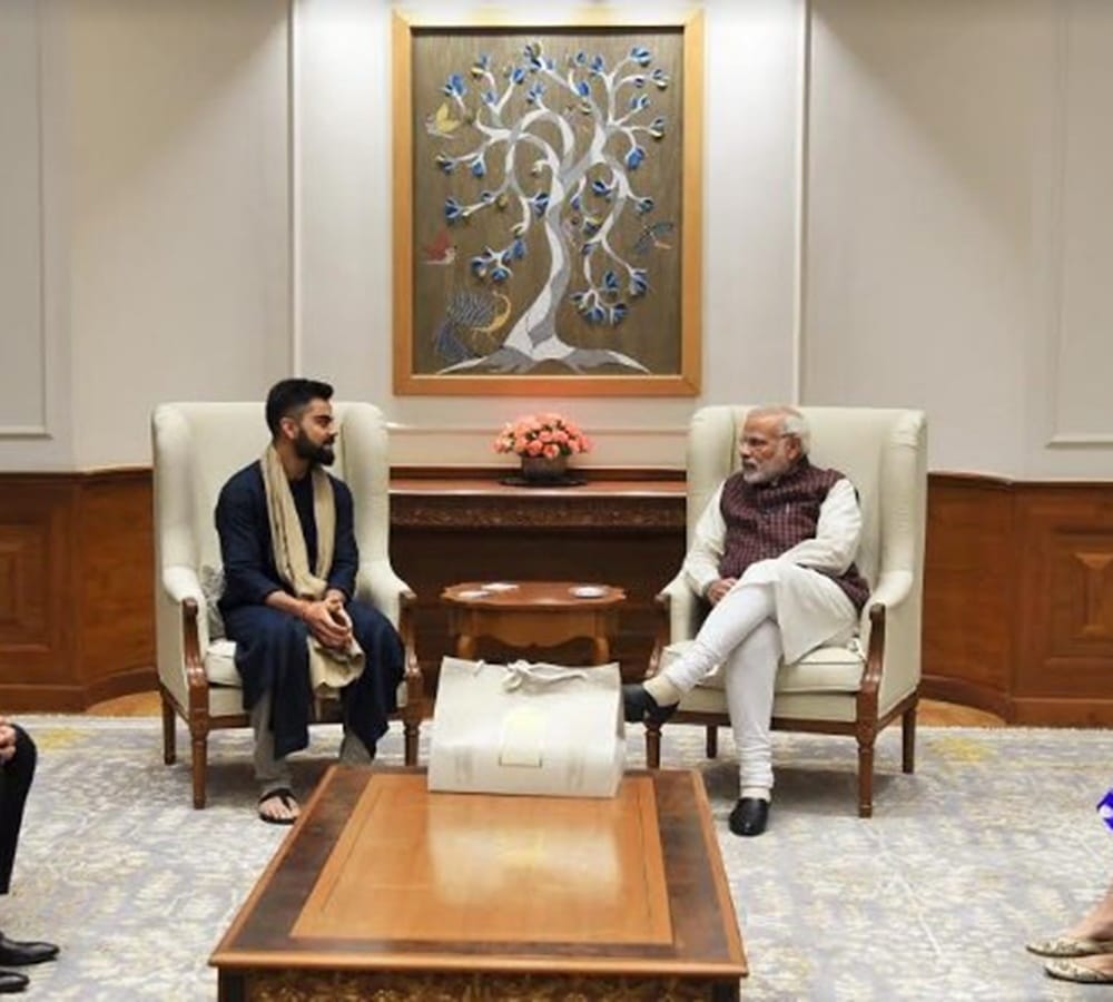 anushka sharma and virat kohli met pm modi and give invitation card