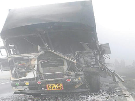 Container collided with a truck standing in the fog, a fire