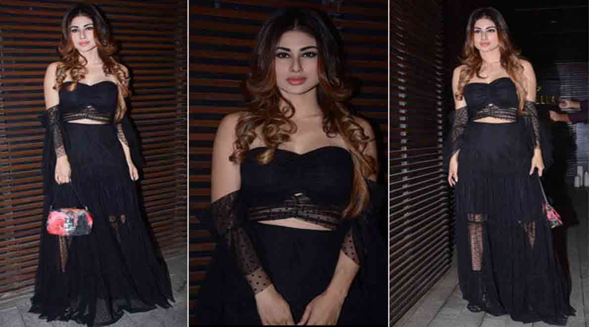 mouni roy show her boldness in back less dress enters in a party