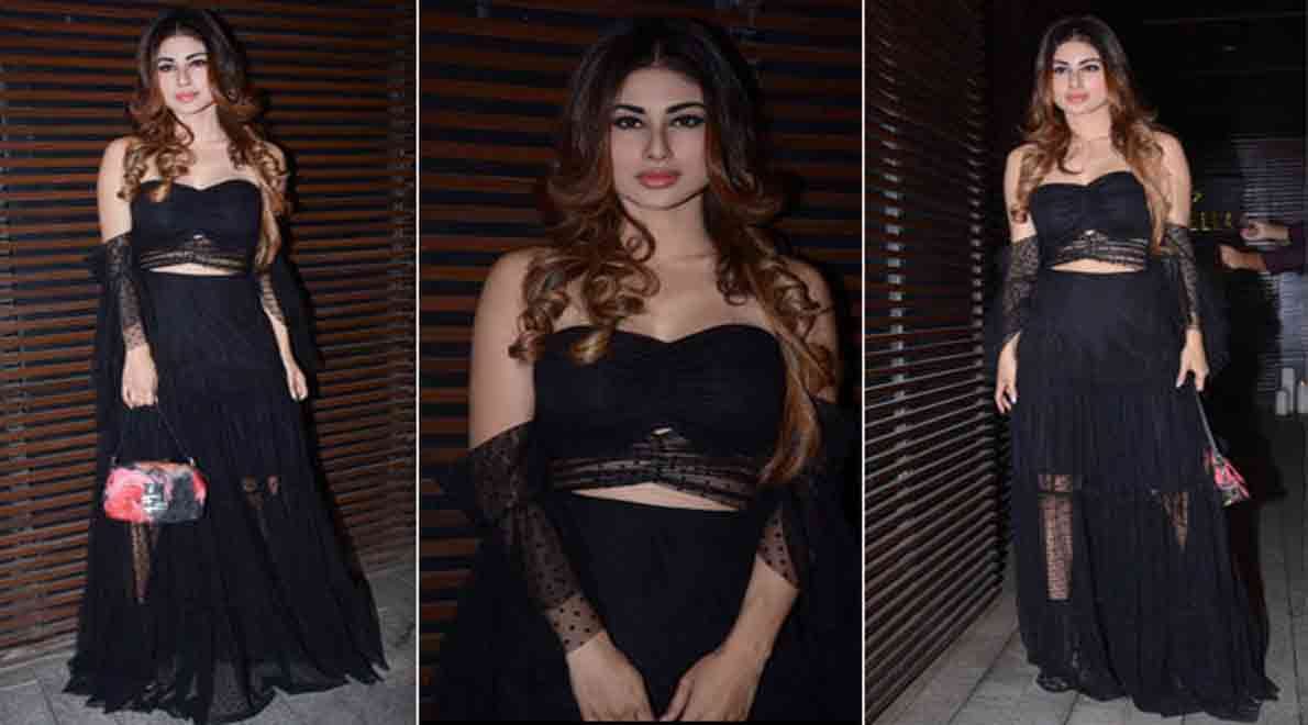 mouni roy show her boldness in back less dress enters in a party
