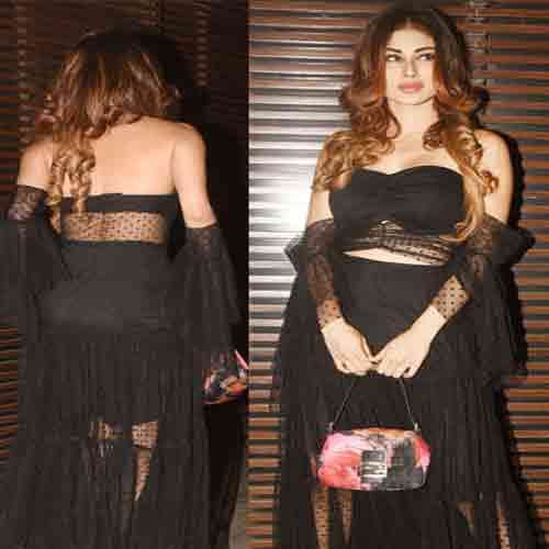mouni roy show her boldness in back less dress enters in a party
