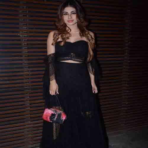 mouni roy show her boldness in back less dress enters in a party