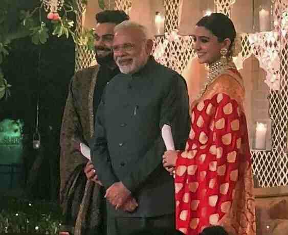Anushka wearing banarasi sari at wedding reception