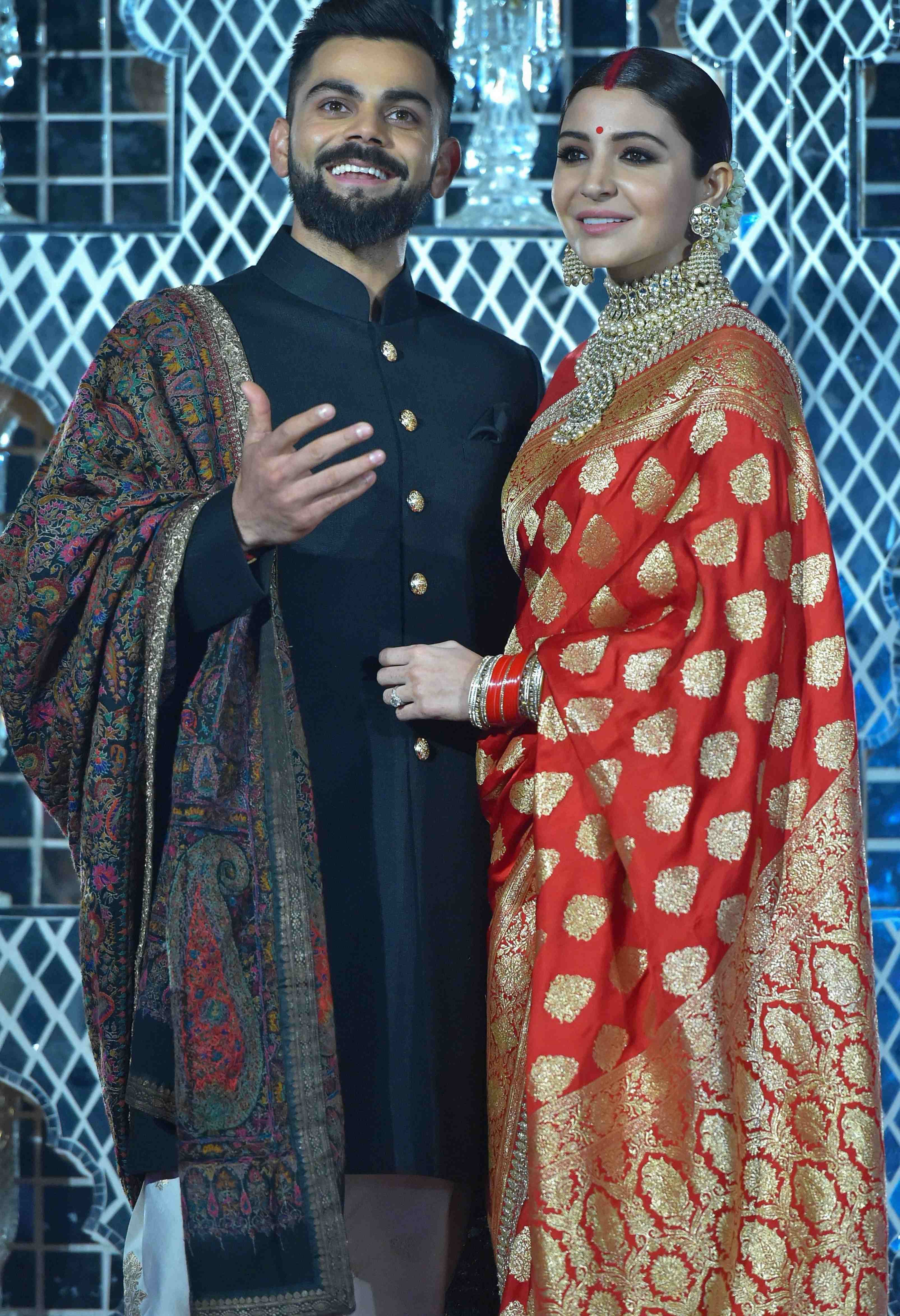 Anushka wearing banarasi sari at wedding reception