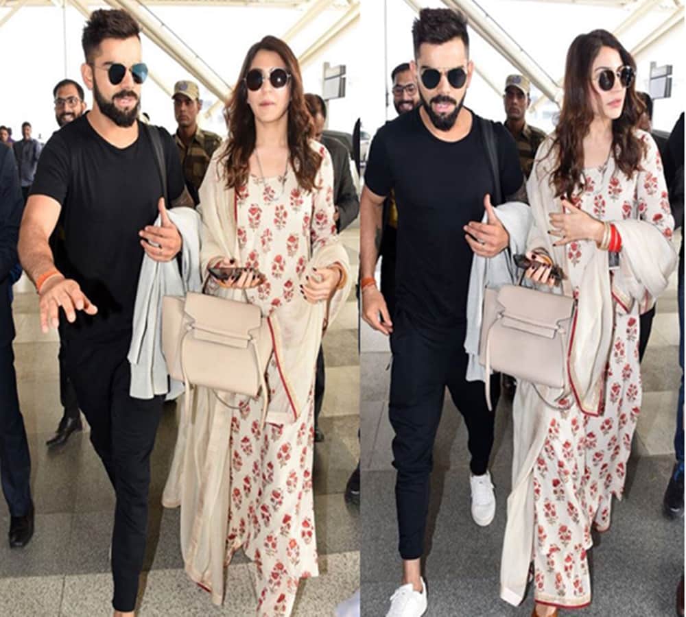 anushka sharma and virat kohli spotted at delhi airport