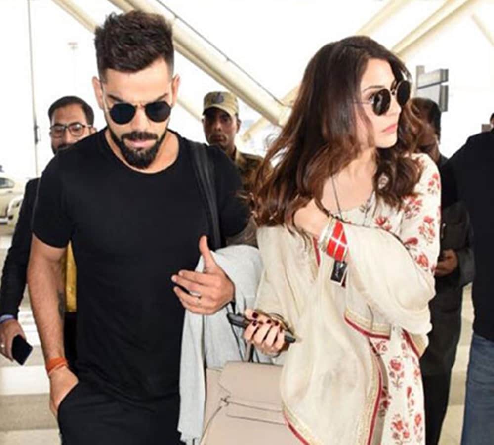 anushka sharma and virat kohli spotted at delhi airport