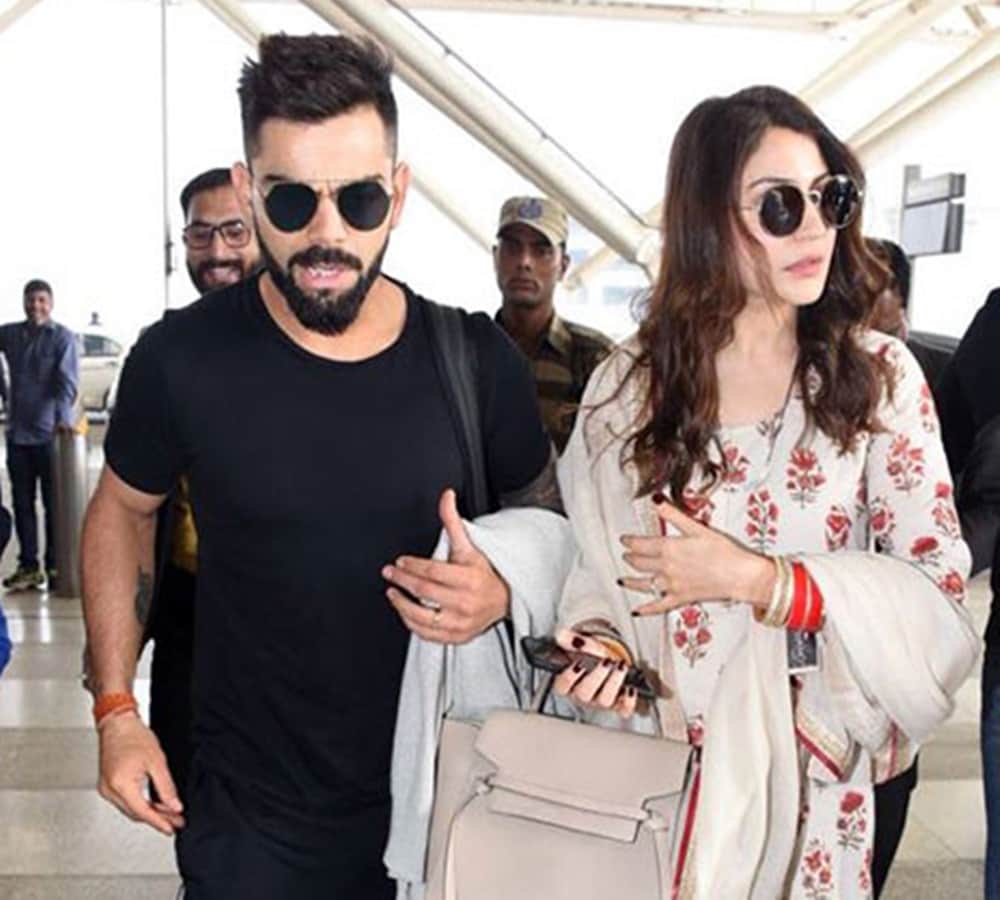 anushka sharma and virat kohli spotted at delhi airport