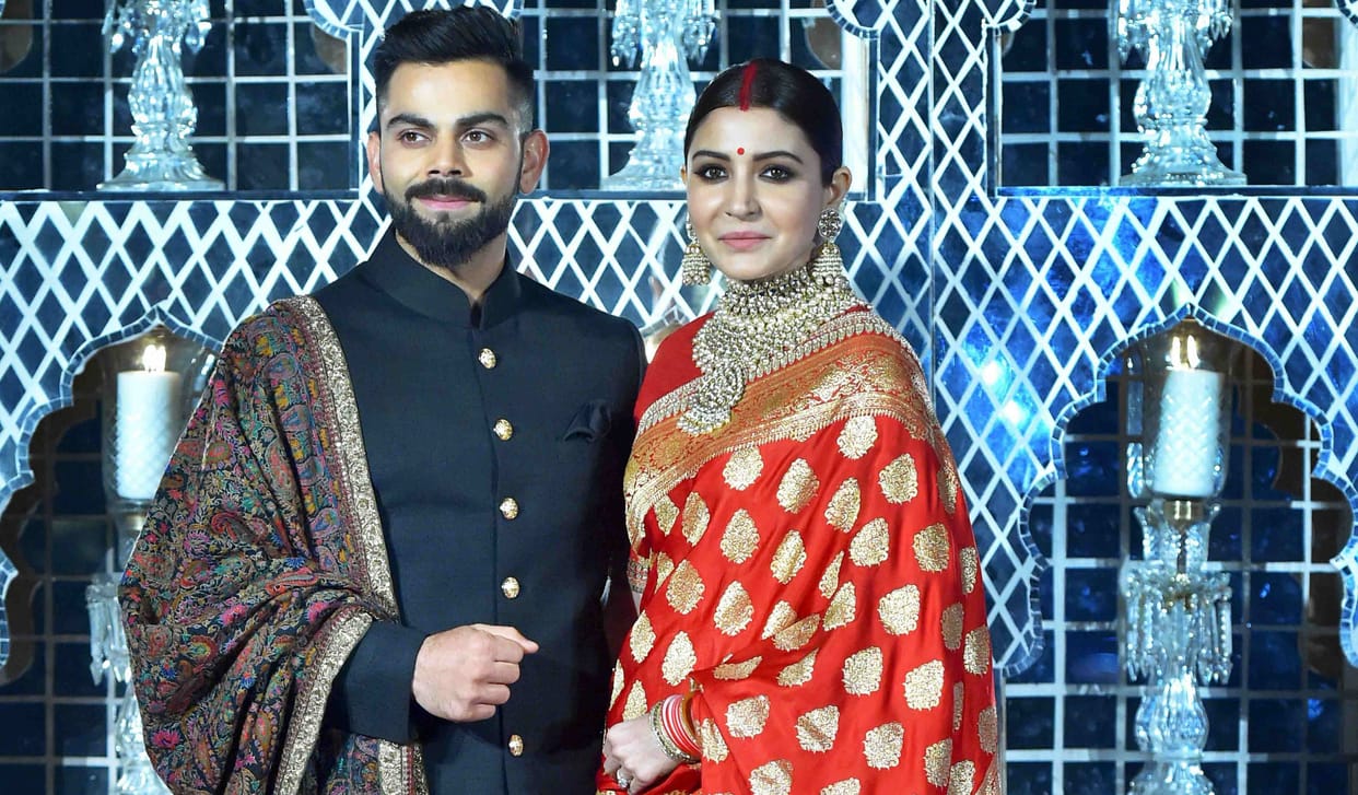 Anushka wearing banarasi sari at wedding reception