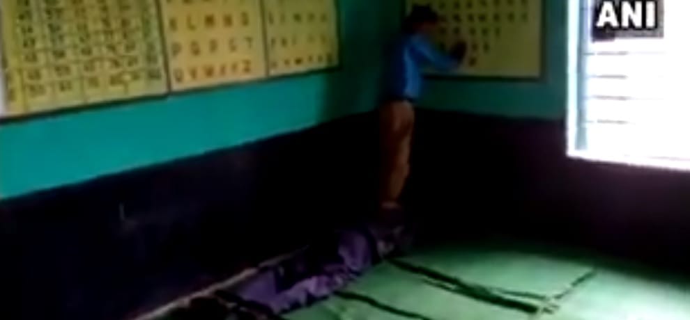 Teacher taking massage from student in Government school in Madiyado Damoh Madhya Pradesh