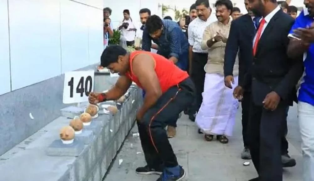 Abhish p Dominic make Records to broke 122 Coconut with in a minute in kerala