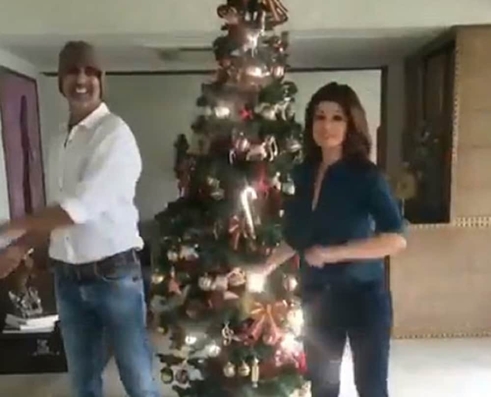 akshay and twinkle khanna wishing their fans merry christmas while dancing around the christmas tree