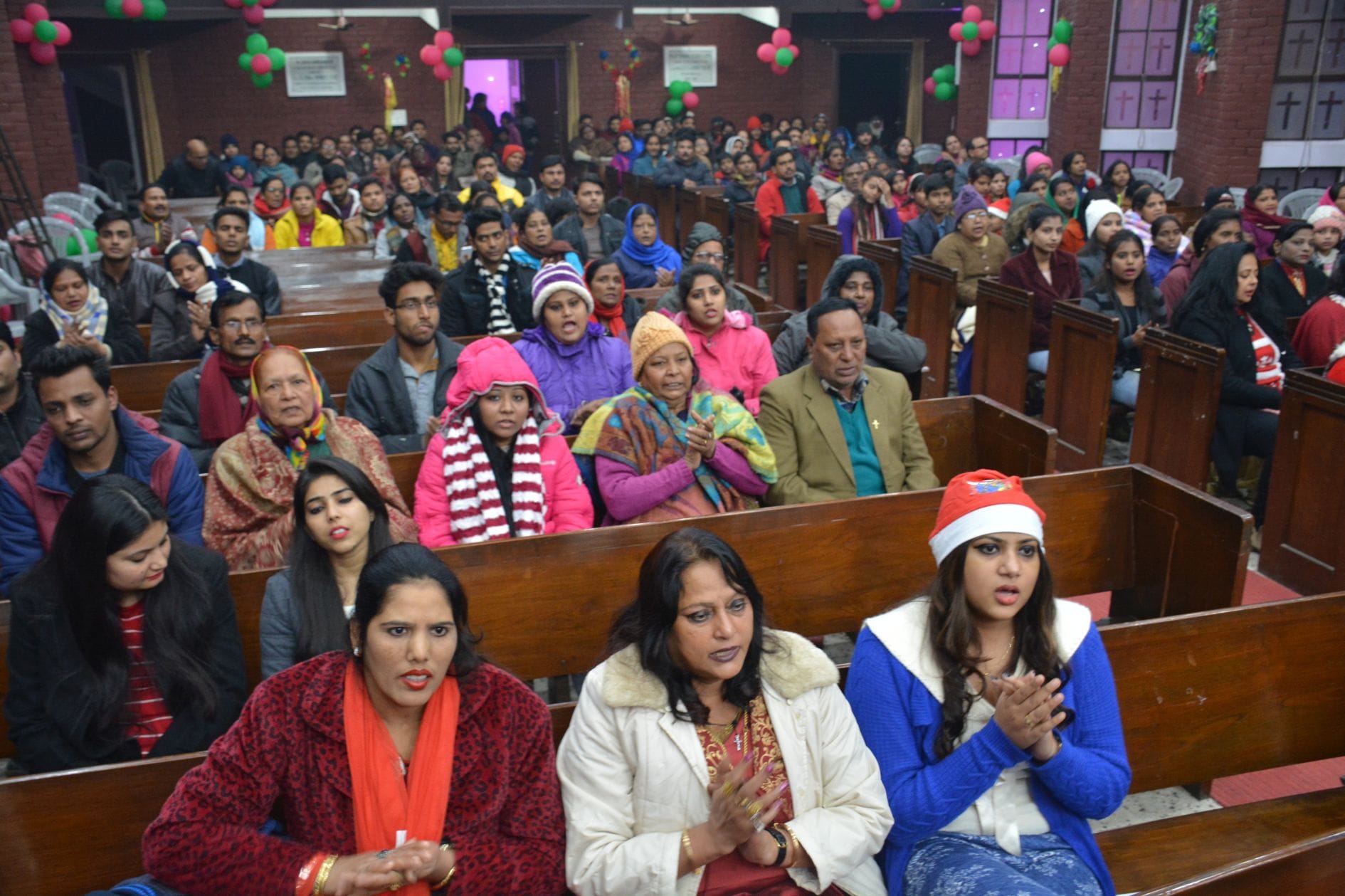christmas eve christians singing carells and say merry christmas at mid night