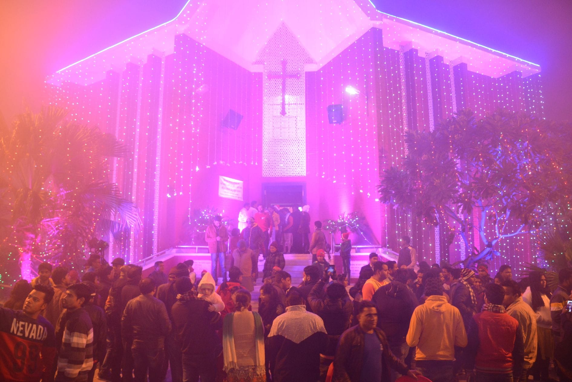 christmas eve christians singing carells and say merry christmas at mid night