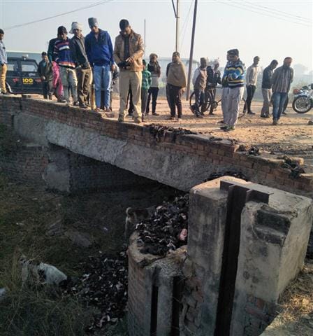 Waste material of meet through in drain in Aligarh
