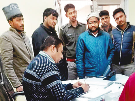 Three arrested including graduate student in arms shop loot