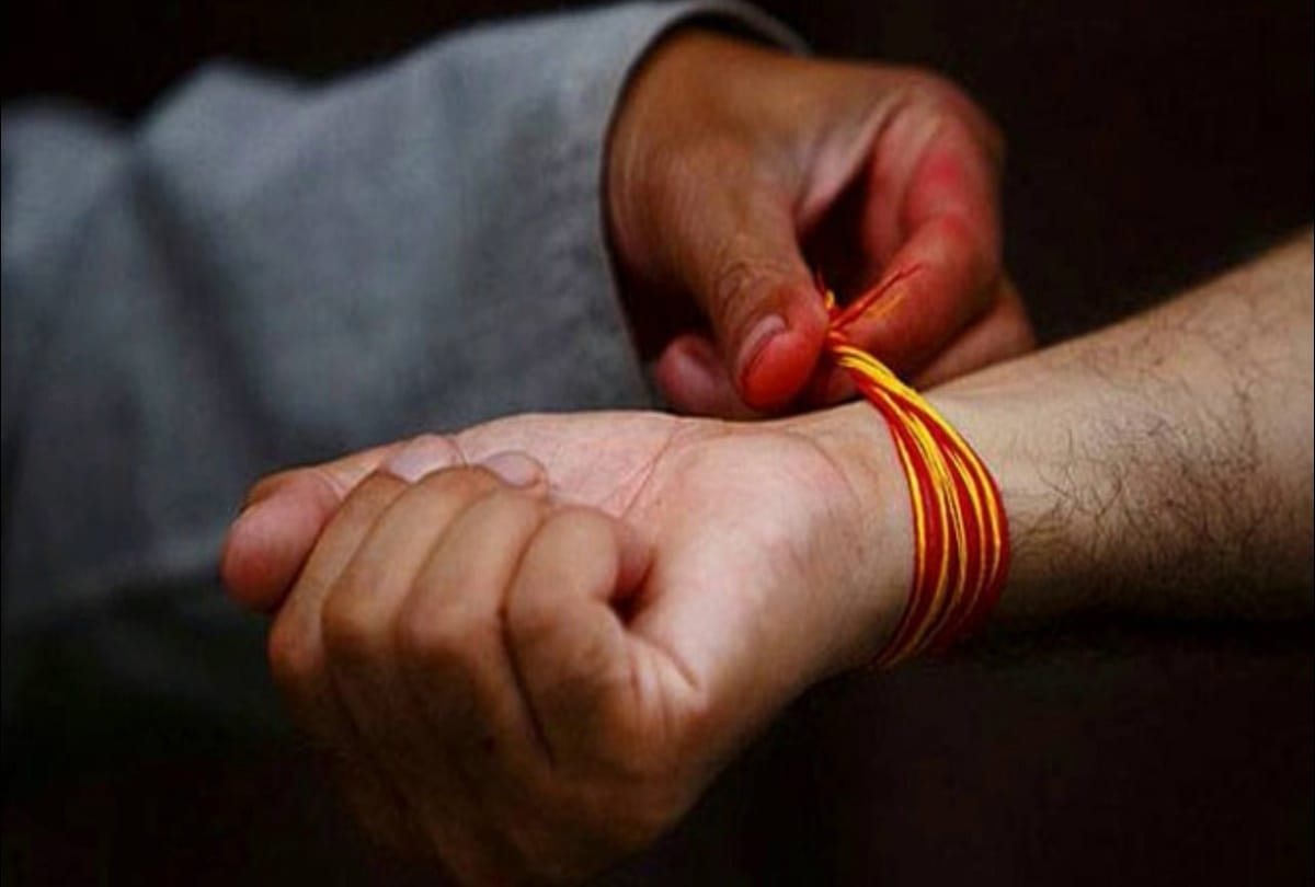 these auspicious benefits to tied red thread or kalava on hand