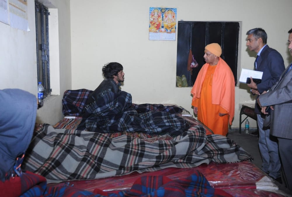 yogi adityanath visits a rain basera in lucknow.
