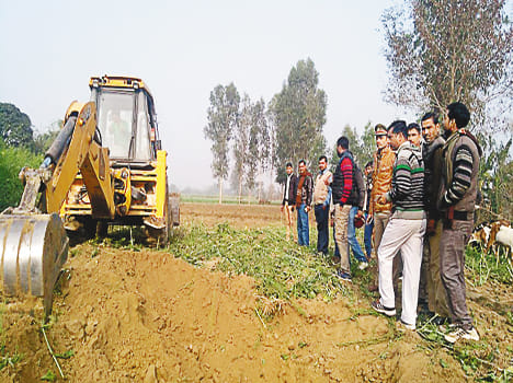 450 bigha of pasta land free of occupancy, JCB runs on crops